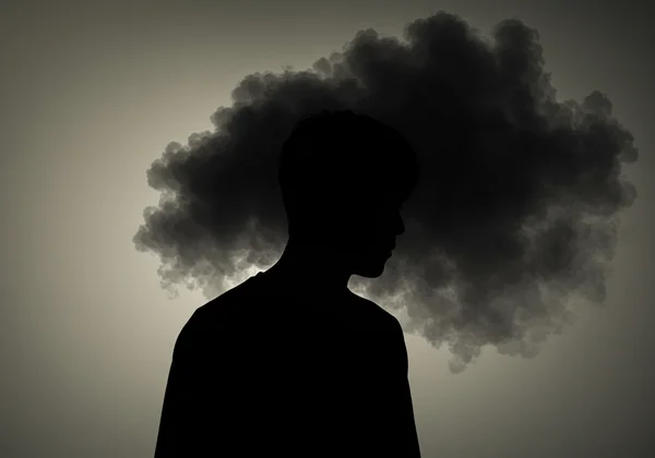Personne sous une ombre, représentant des soucis persistants.